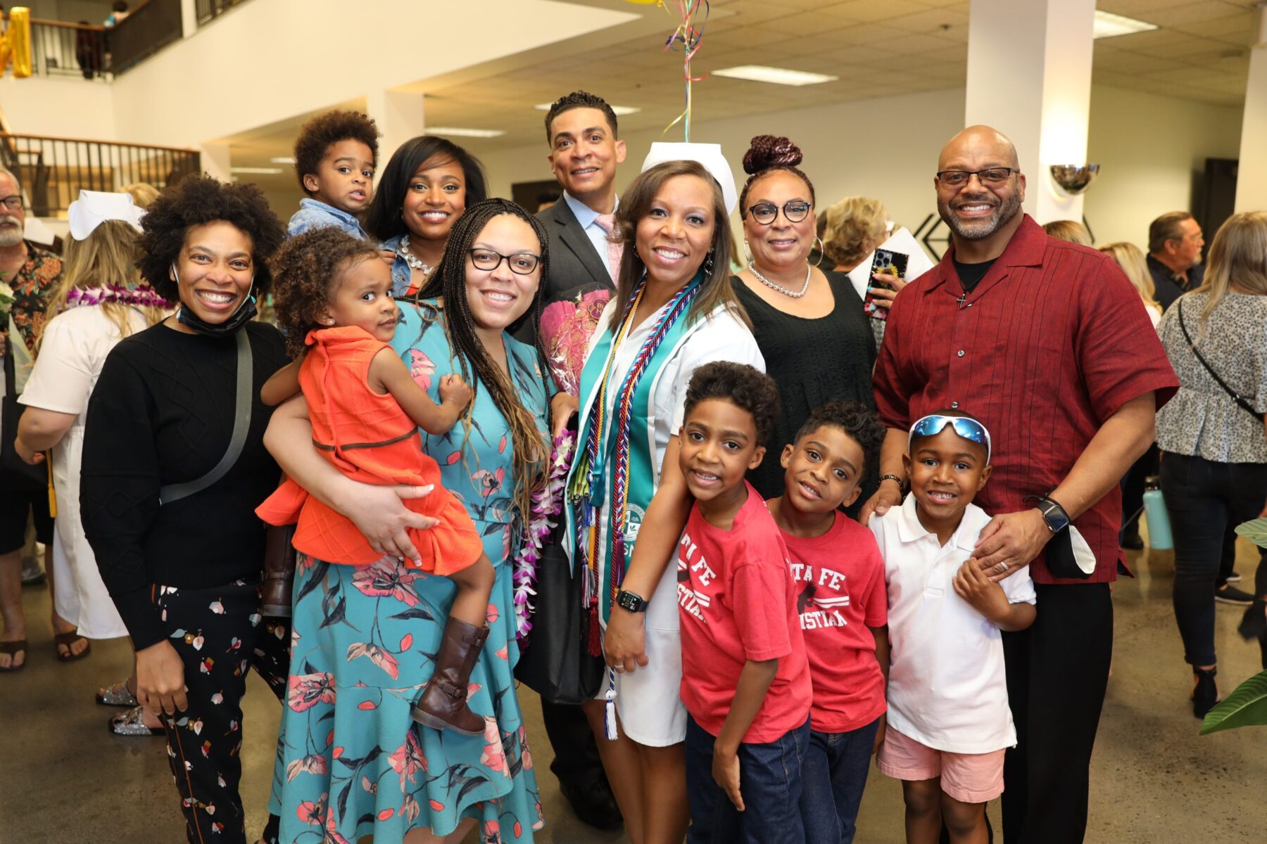Willina in her cap and gown with famiily