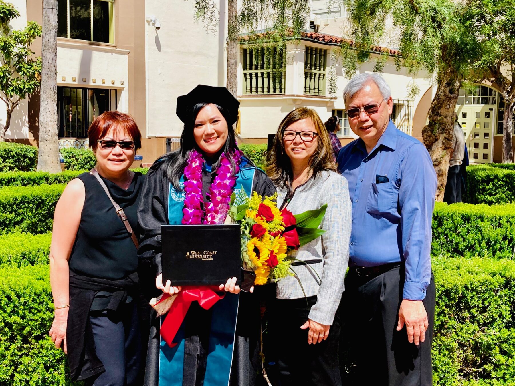 Melysa Q. with her family on graduation day.